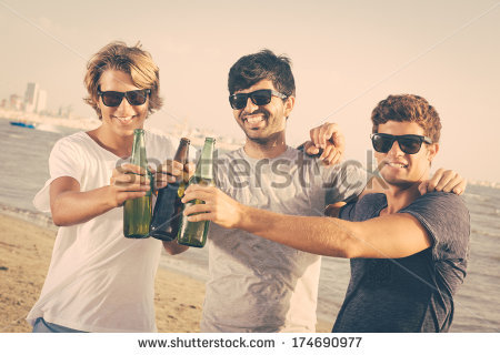 stock-photo-group-of-boys-cheering-at-beach-174690977
